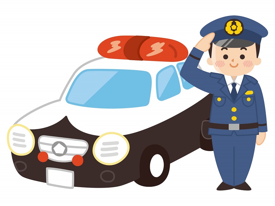 敬礼する男性警察官とパトカー